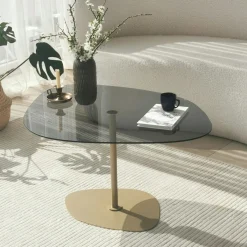 Table basse verre fumé minimaliste, galet et pied doré TULUM